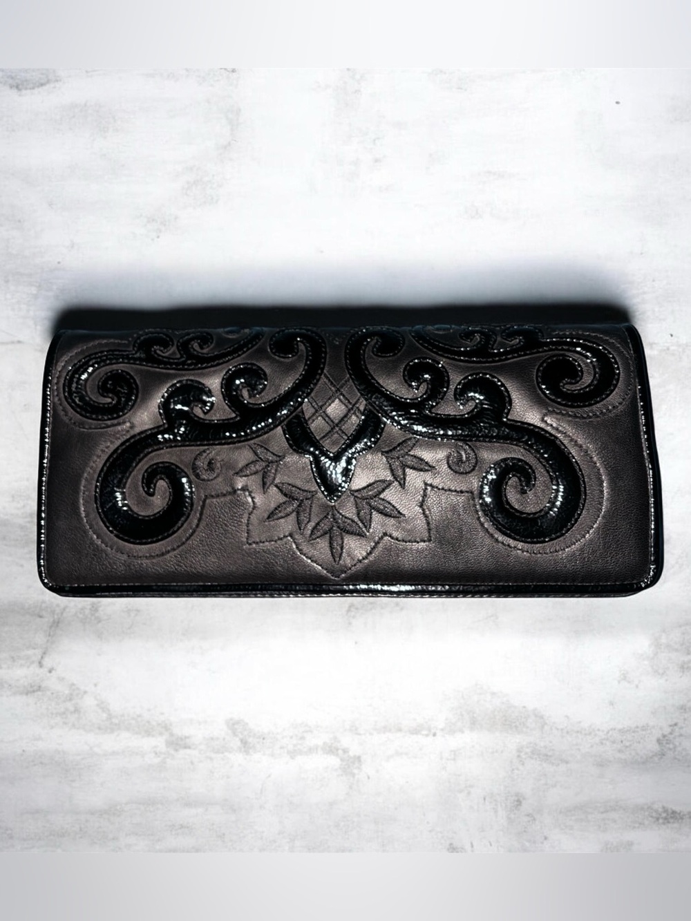 Isabella Fiore Black Embossed Leather Clutch with Glossy Scrollwork